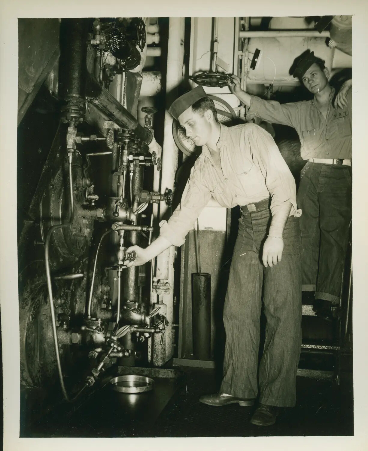 Sailors at Machinery Valve Station Aboard USS Petrof Bay (CVE-80), WWII