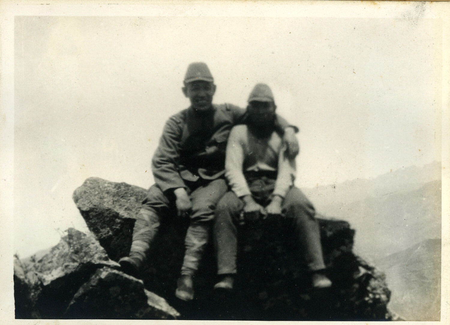 Two Japanese Soldiers Resting on a Mountain Summit During a Field Campaign