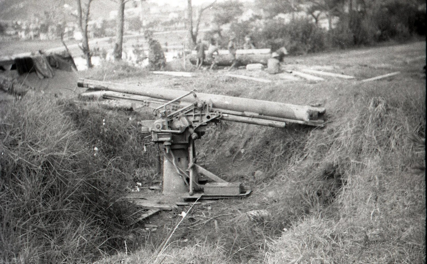 Disabled Japanese Anti-Aircraft/Field Gun in Emplacement Pit, Alternate View, Luzon, Philippines, WWII
