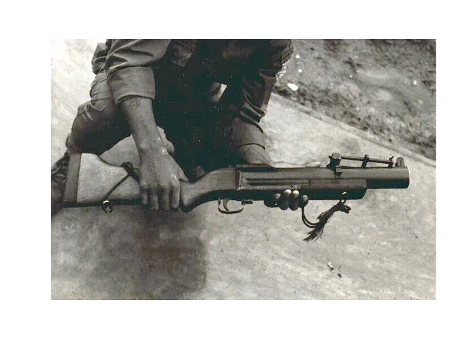 Close-Up of M79 Grenade Launcher Held by Serviceman, Vietnam War Era