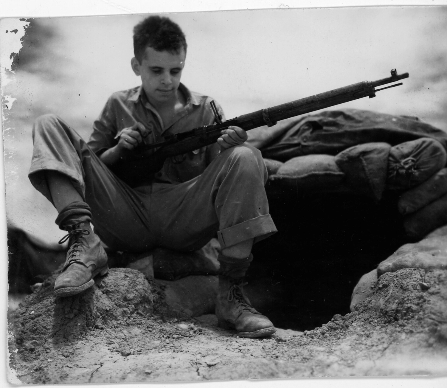 Soldier with Bolt-Action Rifle at Sandbagged Foxhole, WWII Airfield Defense Position