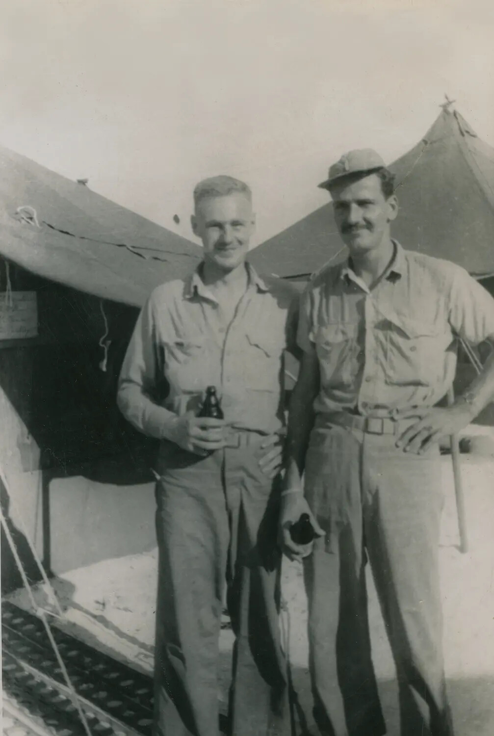 Two American Servicemen Posing Off-Duty at a Tented Camp, WWII-Era Overseas Deployment