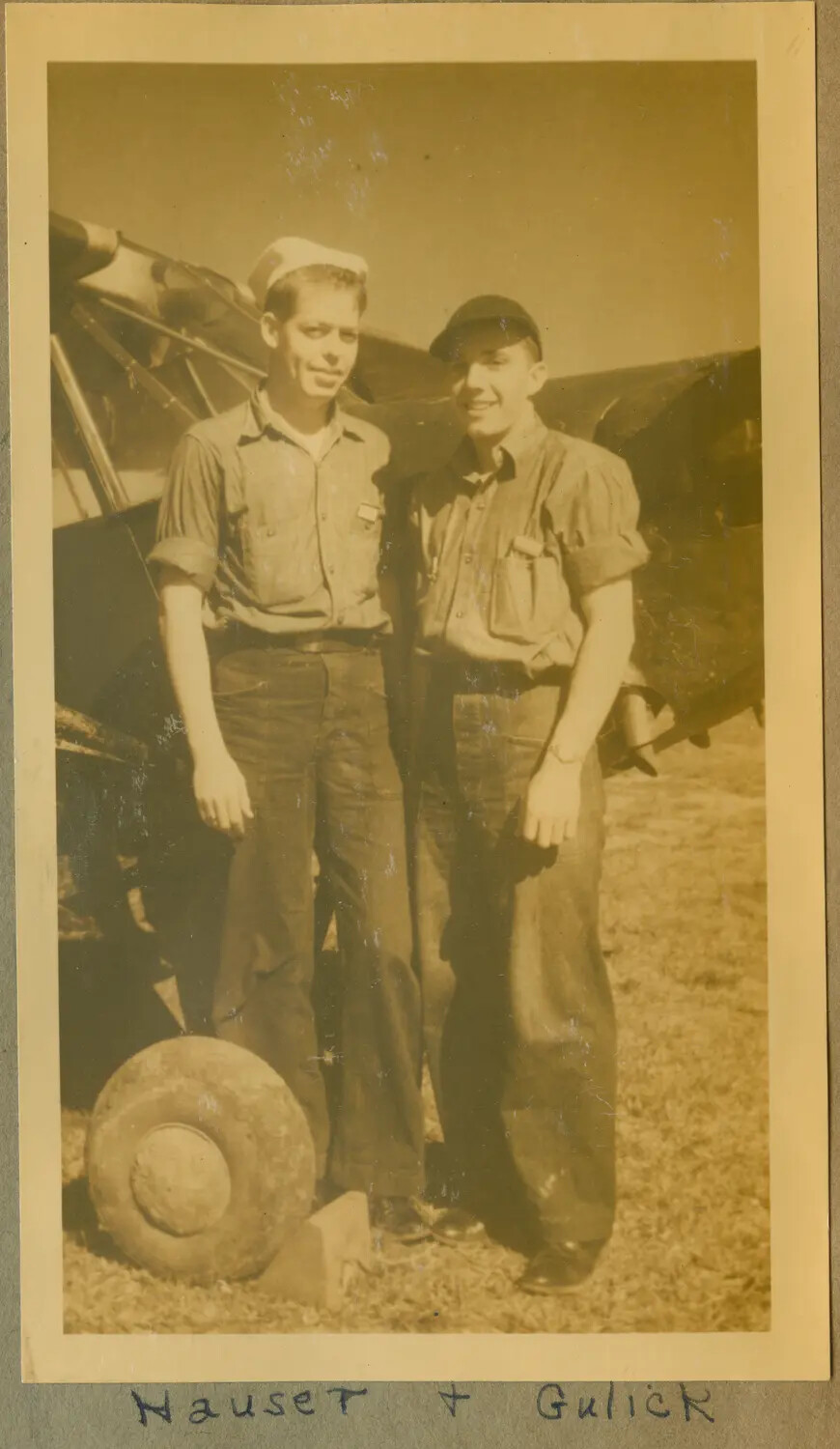 Two Cadets, "Hauser + Gulick," Beside Trainer Aircraft with Detached Wheel