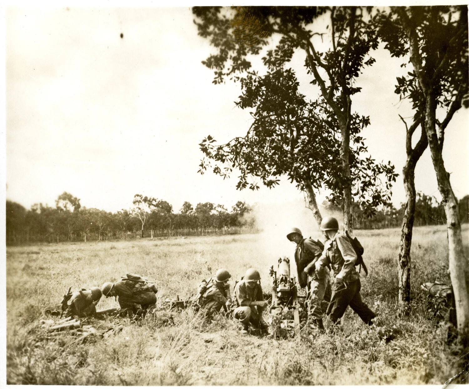 Soldiers Operating Mortar/Light Artillery Piece in Field Exercise