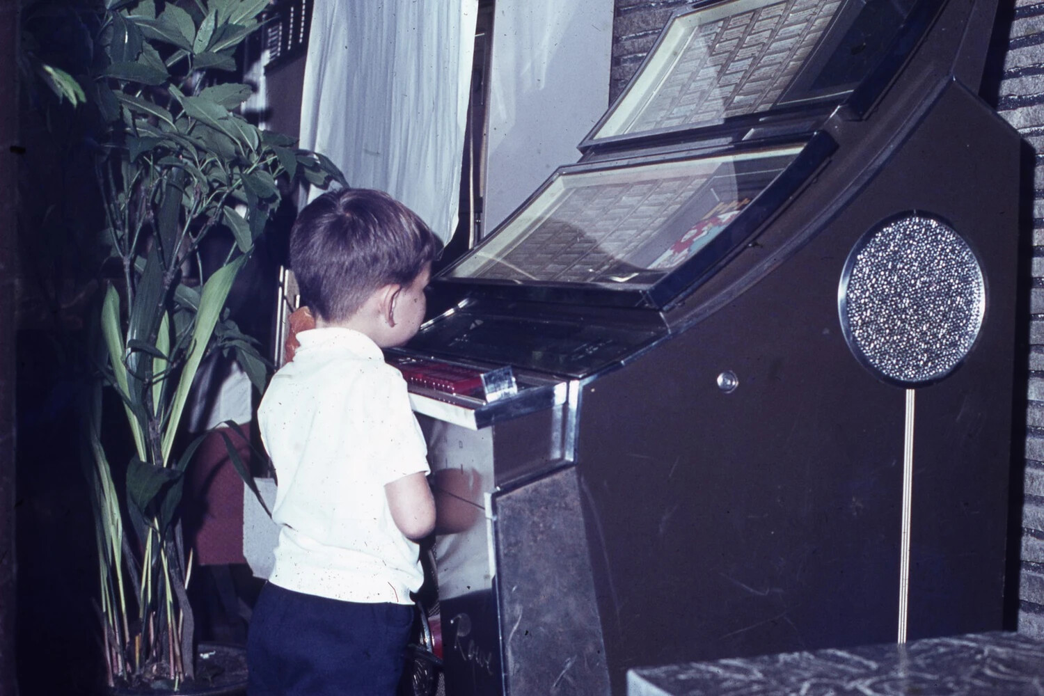 Young Boy at a Vintage Jukebox, Family Snapshot, Mid-20th Century