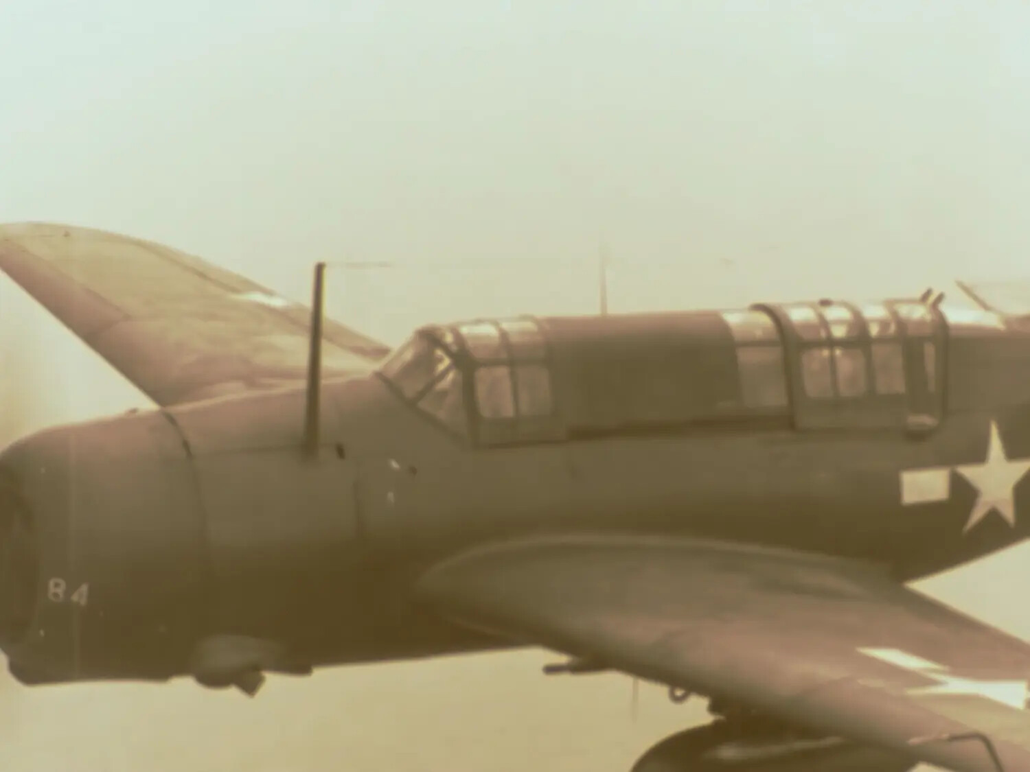 U.S. Navy Carrier Dive Bomber "84" in Flight, Color Combat Film Still, Pacific Theater