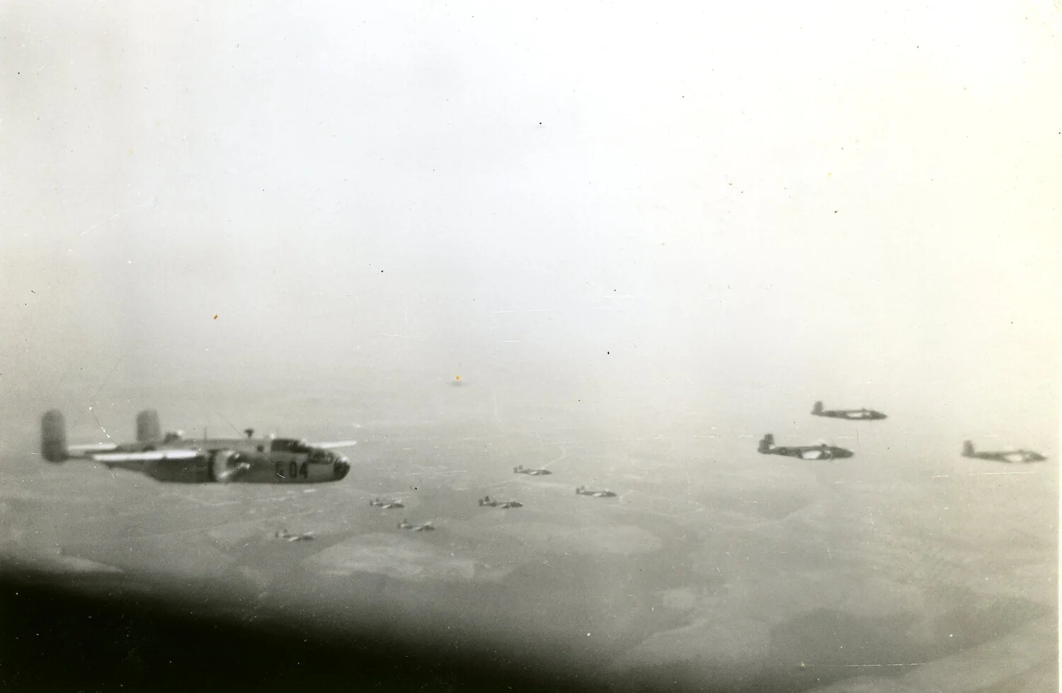 B-25 Mitchell 'E 04' in Formation with Escort Fighters, 345th Bombardment Group, Ie Shima