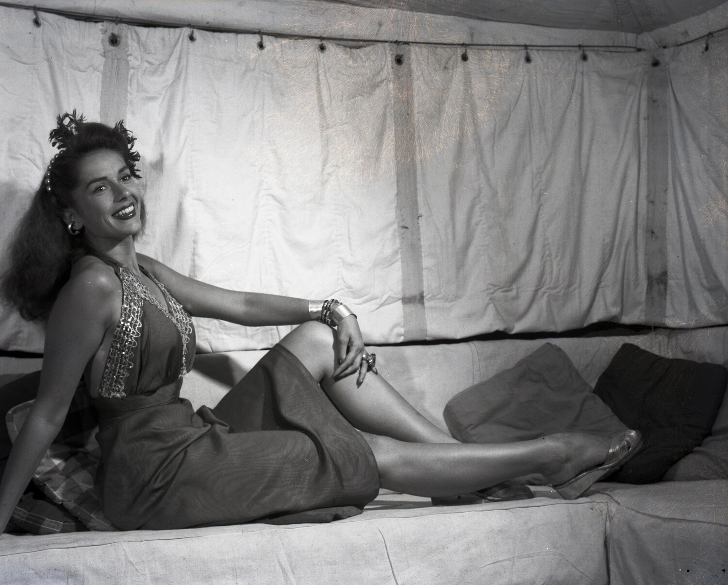 Pin-Up Style Portrait of a Woman Reclining in a Military Tent, China-Burma-India Theater, World War II Era