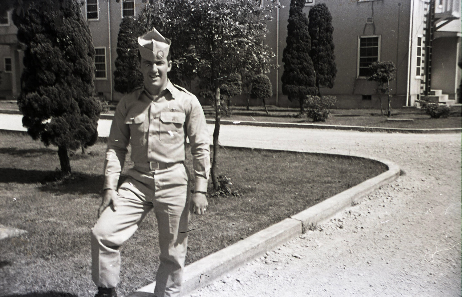 U.S. Army Soldier in Khaki Service Uniform Outside Barracks — 187th Airborne Negatives Collection, Korean War Era