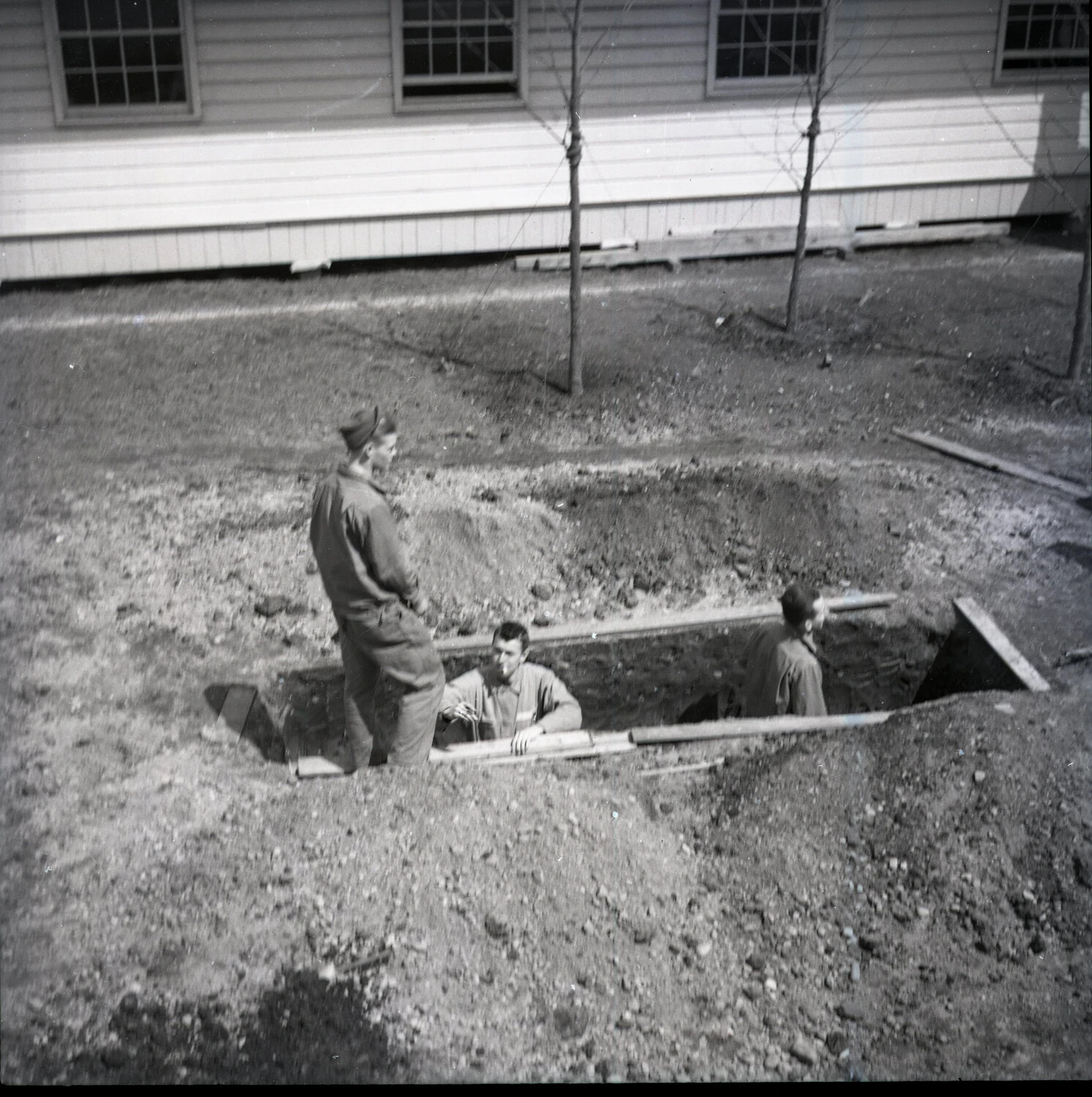 Soldiers Excavating a Pit at a Military Post