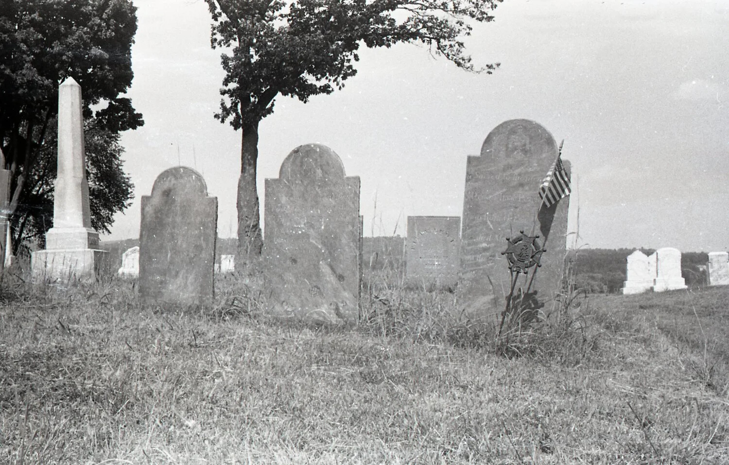 Historic New England Cemetery with GAR Veteran's Grave Marker and Flag