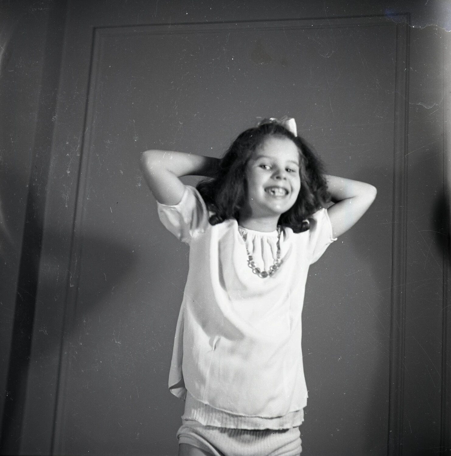 Candid Portrait of a Young Girl Posing Playfully Indoors
