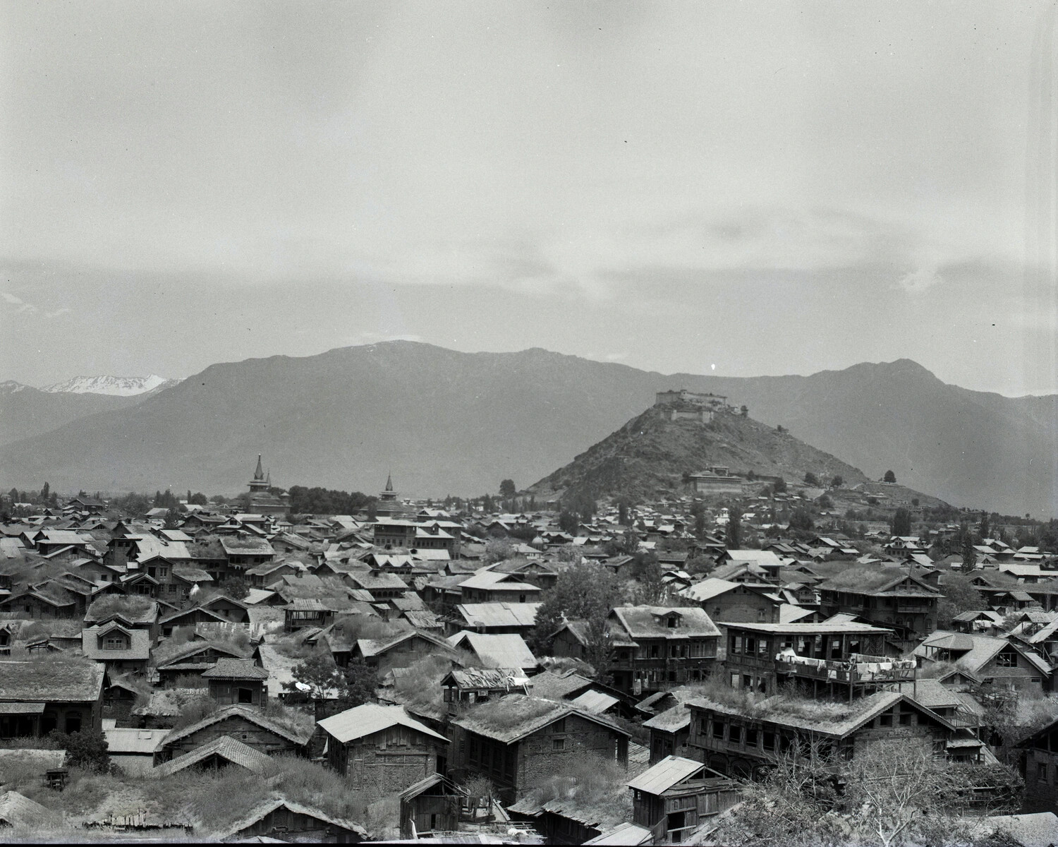 Elevated View of a Kashmiri Town with Hilltop Fort and Himalayan Range, WWII-era China-Burma-India Theater Collection