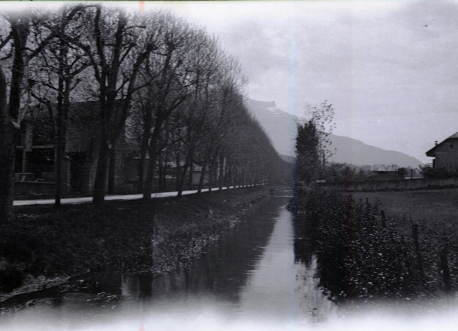 Tree-Lined Canal and Mountain Landscape, Rural France, World War I Era