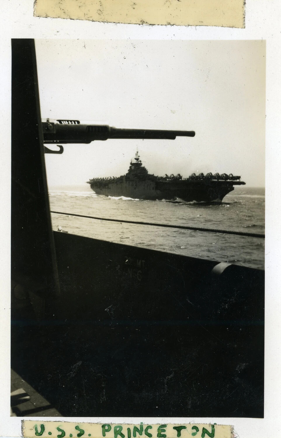 USS Princeton Underway, Viewed Past a 5-inch Gun Mount from an Escorting Warship, WWII/Post-War Era