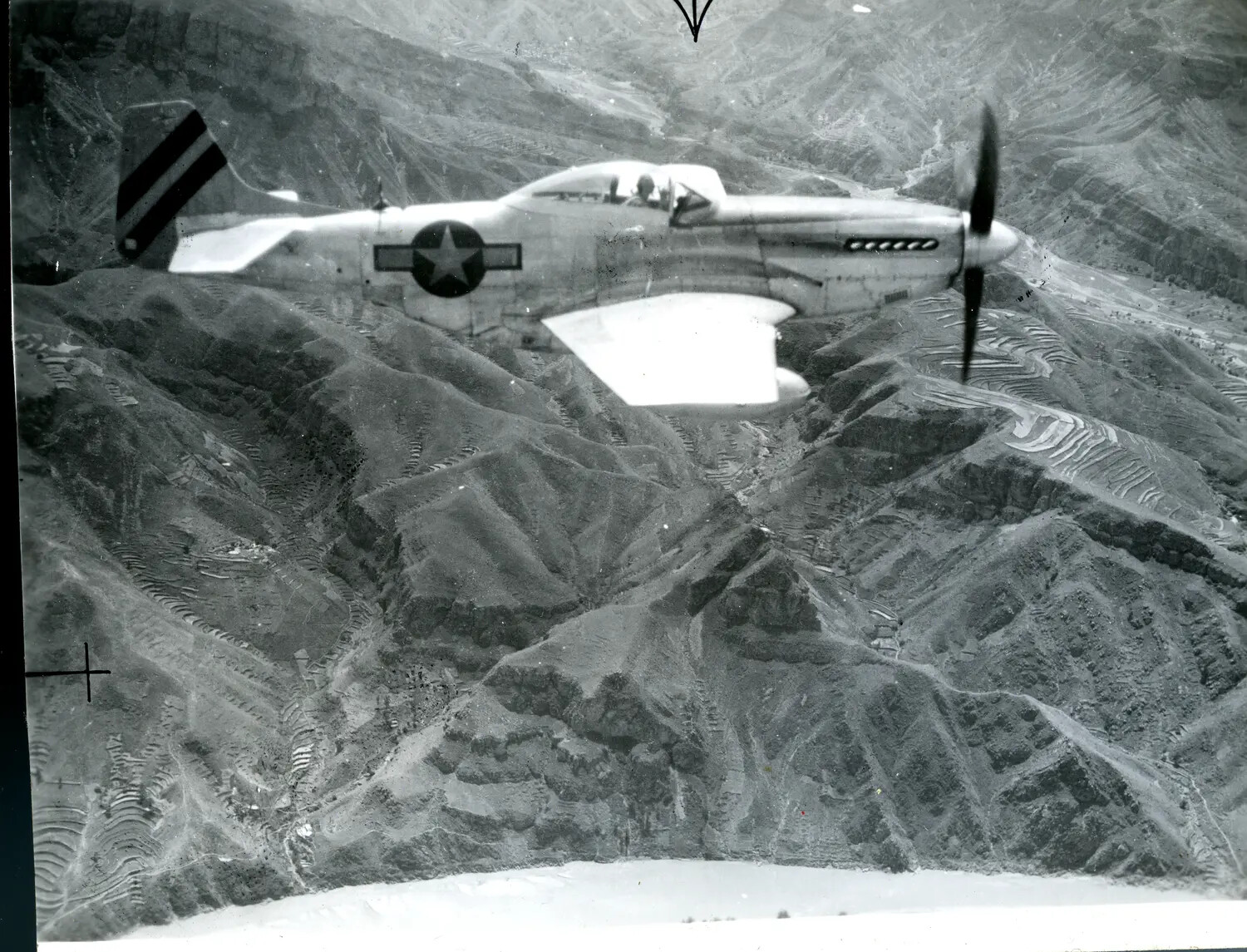 P-51 Mustang Fighter in Flight Over Mountainous Terrain, China-Burma-India Theater, WWII