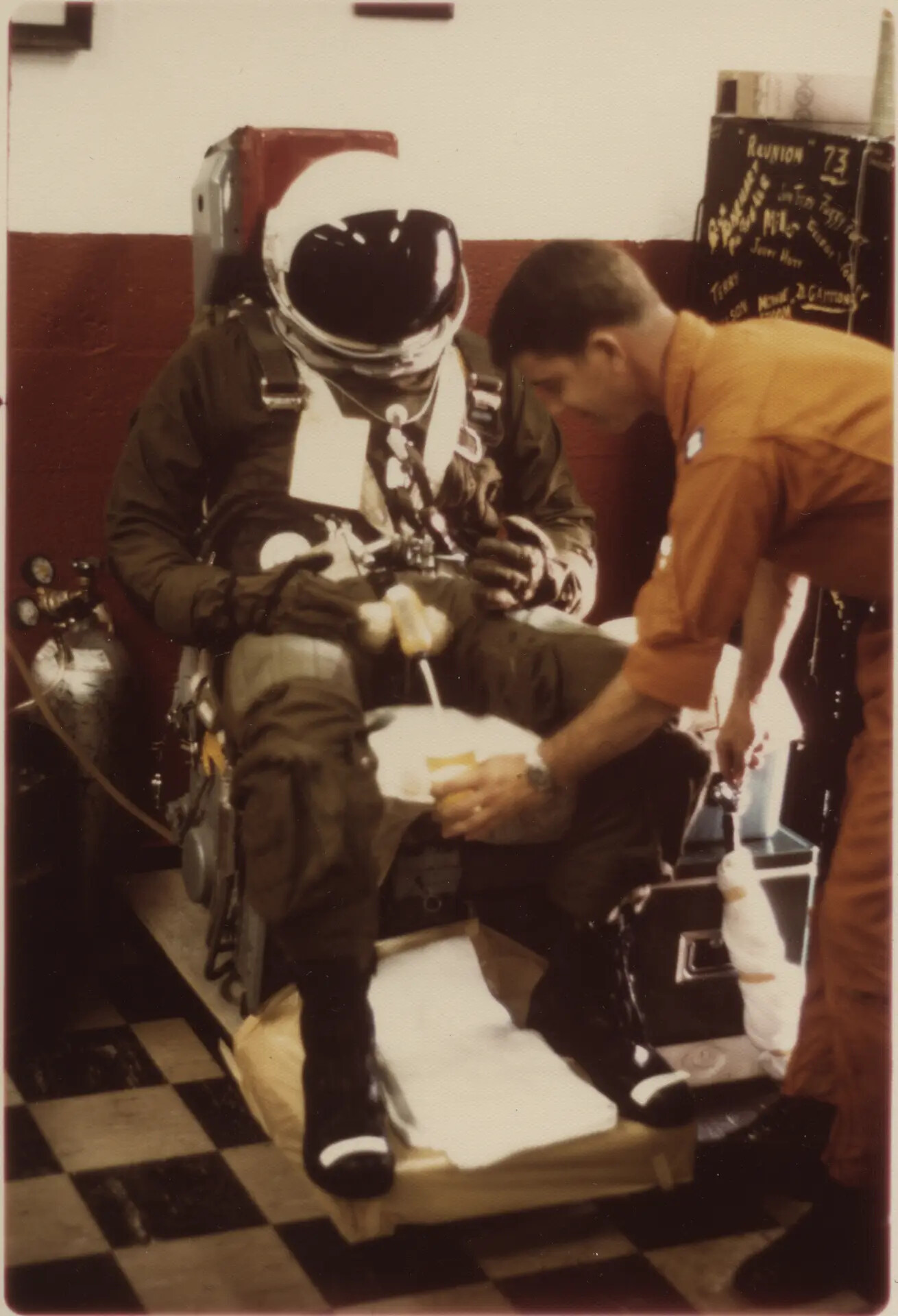 Pilot in Full Pressure Suit with Life Support Technician, 'Jim Winans,' Gary Hawes Collection