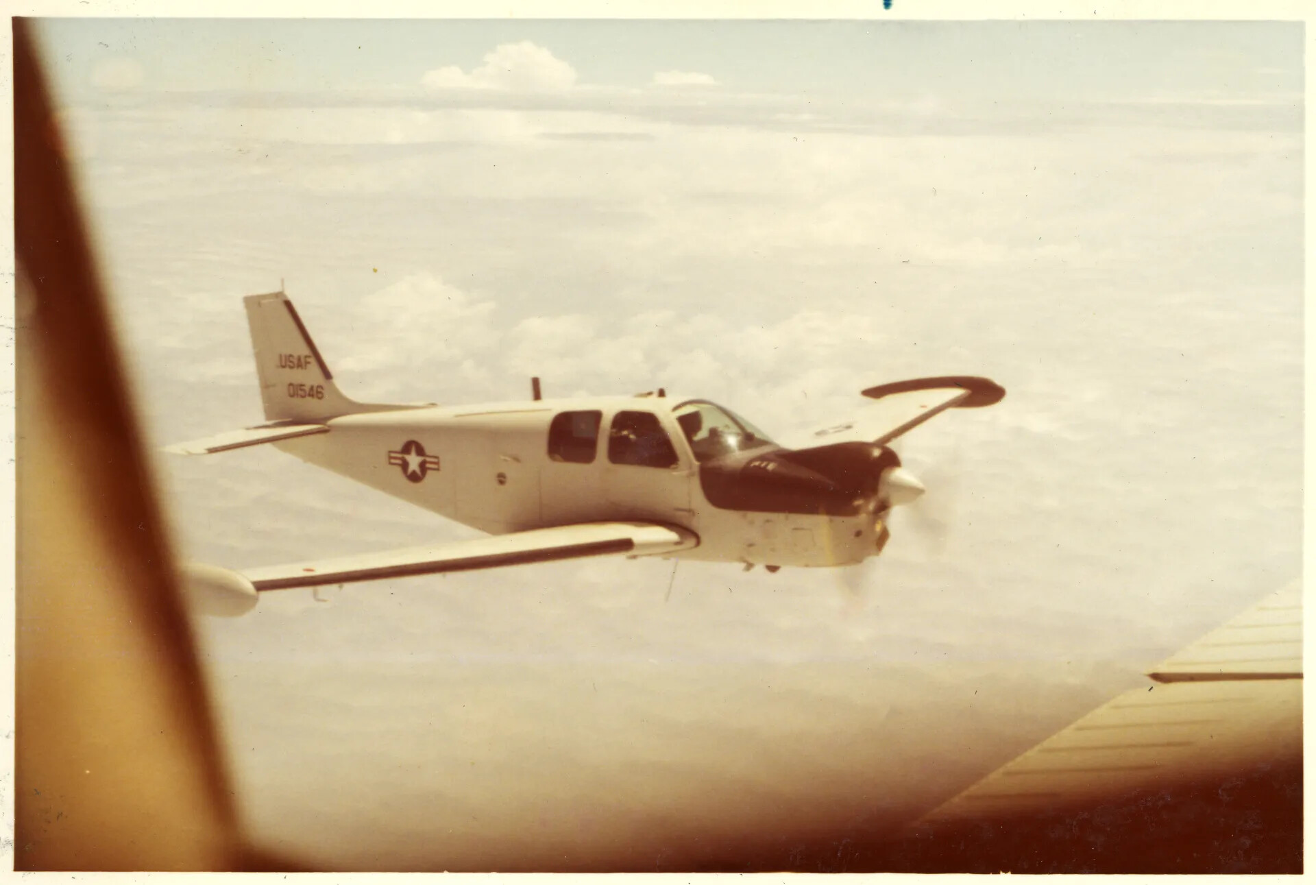 USAF V-Tail Beechcraft Aircraft (Serial 01546) in Flight Near Nakhon Phanom, Vietnam War Era