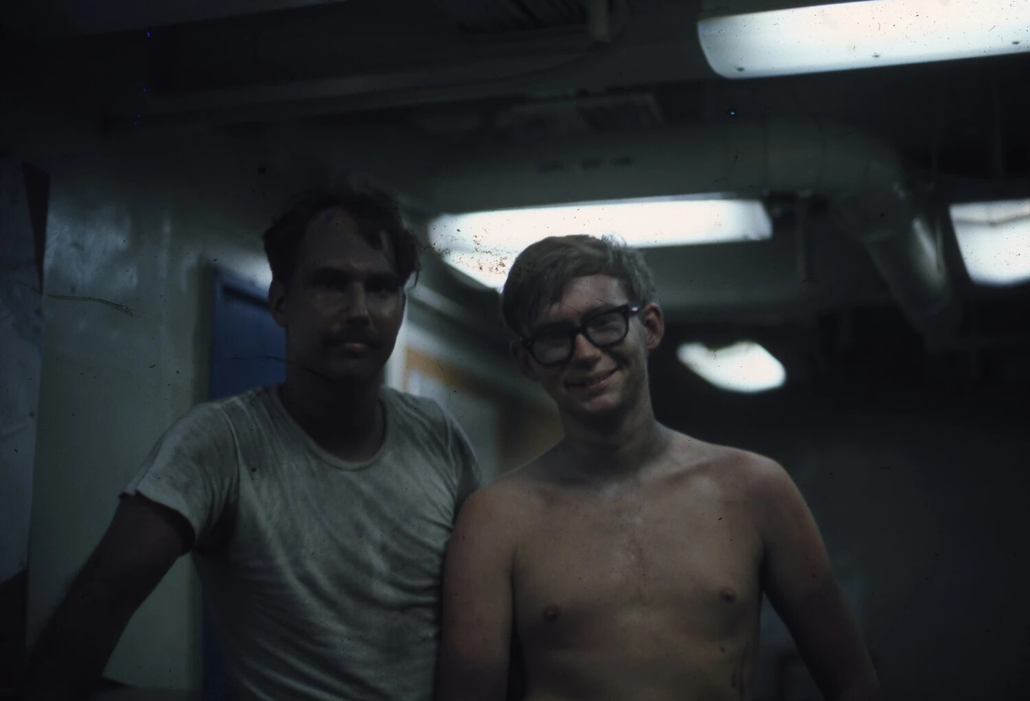 Two Sailors Below Decks Aboard USS Ticonderoga, Vietnam Era