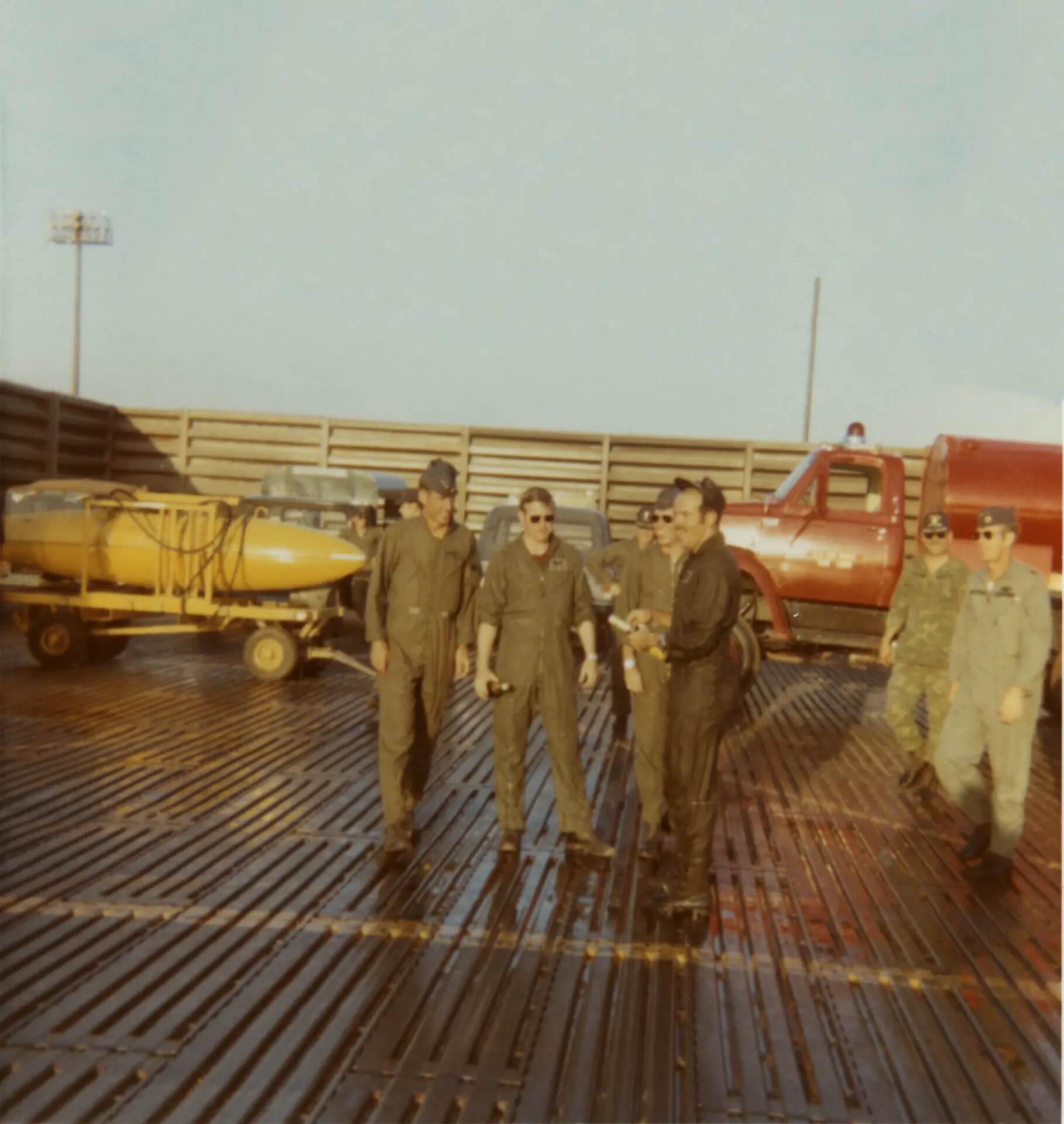 Aircrew Gathered on Flight Line Ramp with Ordnance Trailer, Southeast Asia, Vietnam War Era