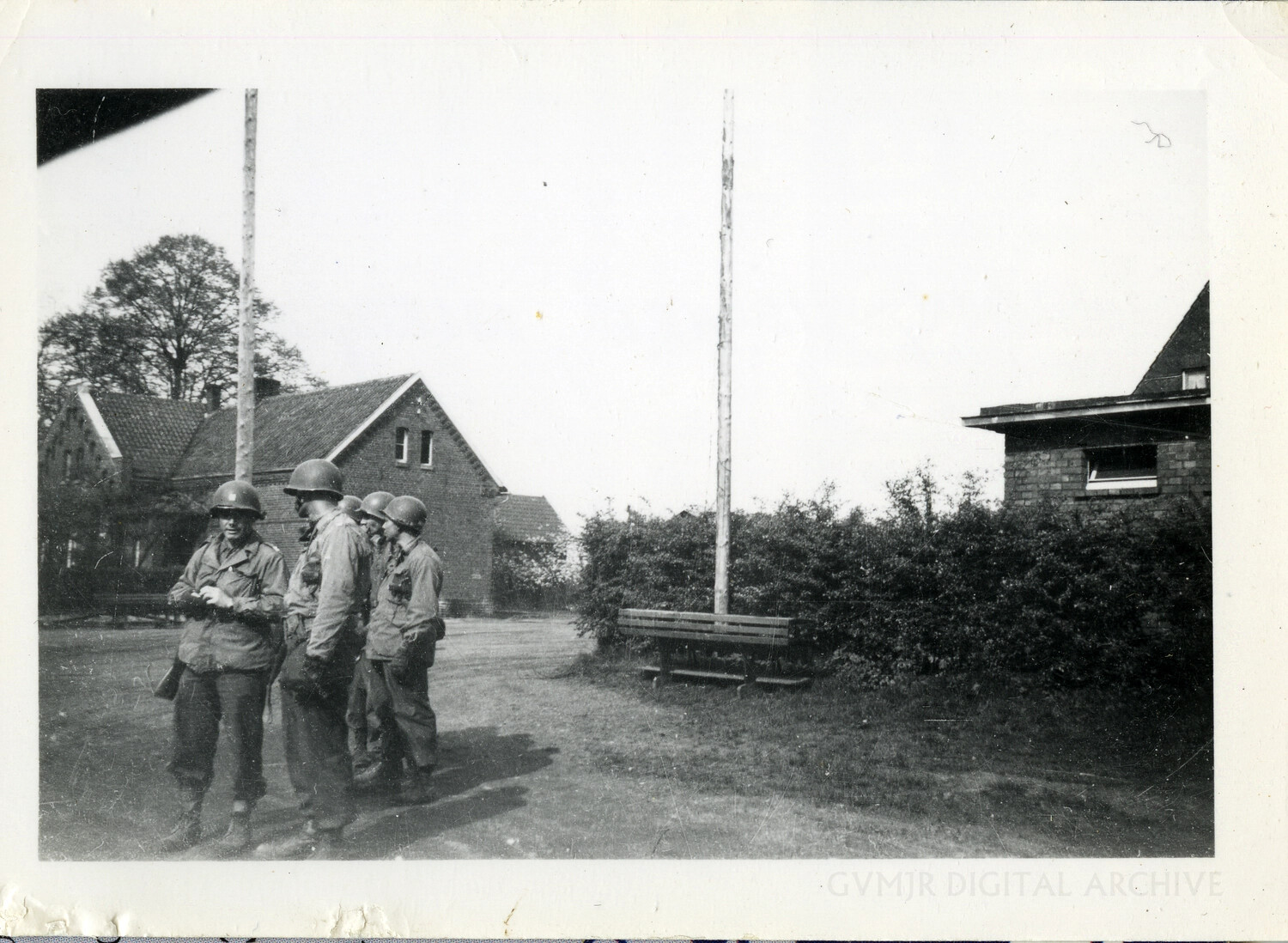 American Soldiers Beside Farmhouse and Flagpoles, Northwest Europe, World War II (101st Airborne Division)