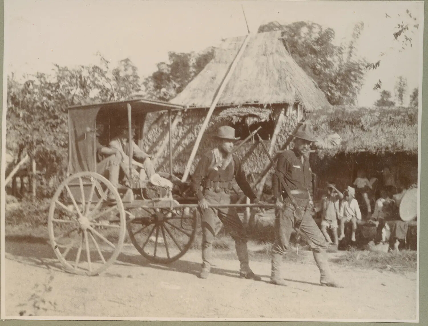 American Soldiers Hauling a Two-Wheeled Cart Past a Nipa Hut, Philippine-American War Era, c. 1899-1902