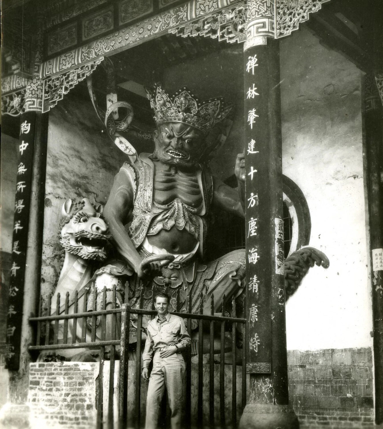American Serviceman at Chinese Temple Guardian Statue, China-Burma-India Theater, WWII