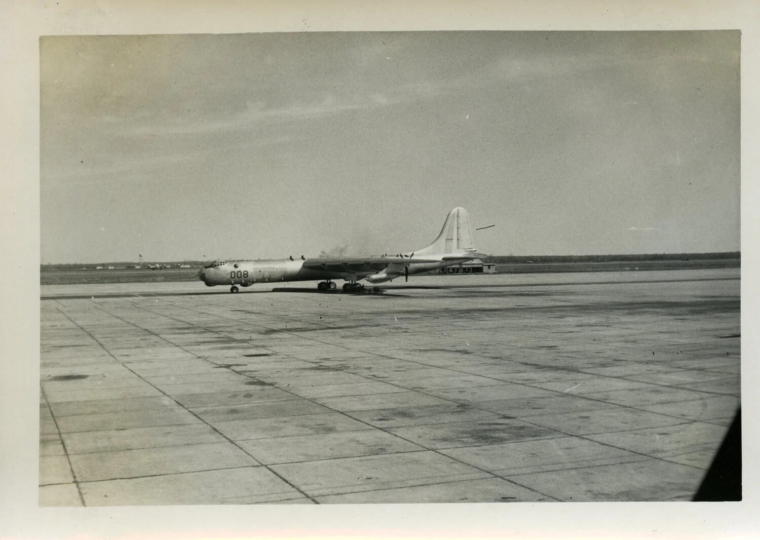 Boeing B-29/B-50 Superfortress-Type Bomber Taxiing on Airfield Ramp, Nose Number 008