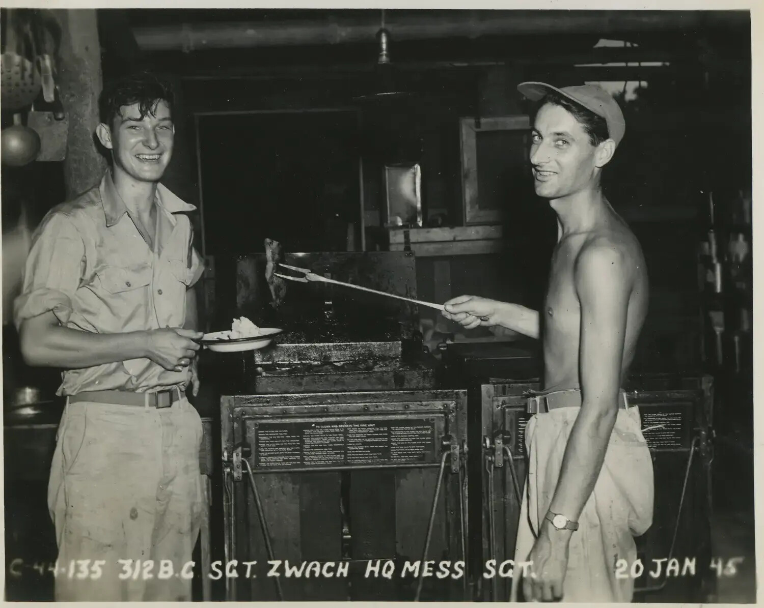 Sgt. Zwach, HQ Mess Sergeant, Preparing Food at Field Range, 312th Bomb Group, 20 Jan 1945