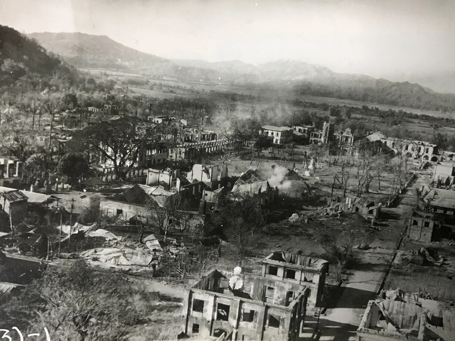 Strike Photograph: Destroyed Philippine Town with Damaged Church, Luzon Campaign, 312th Bomb Group