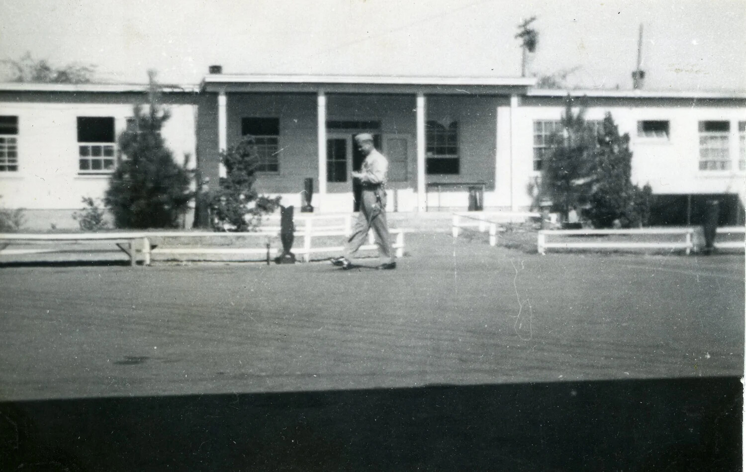 Marine Walking in Front of Barracks Building, VMF-214 Album, 1945