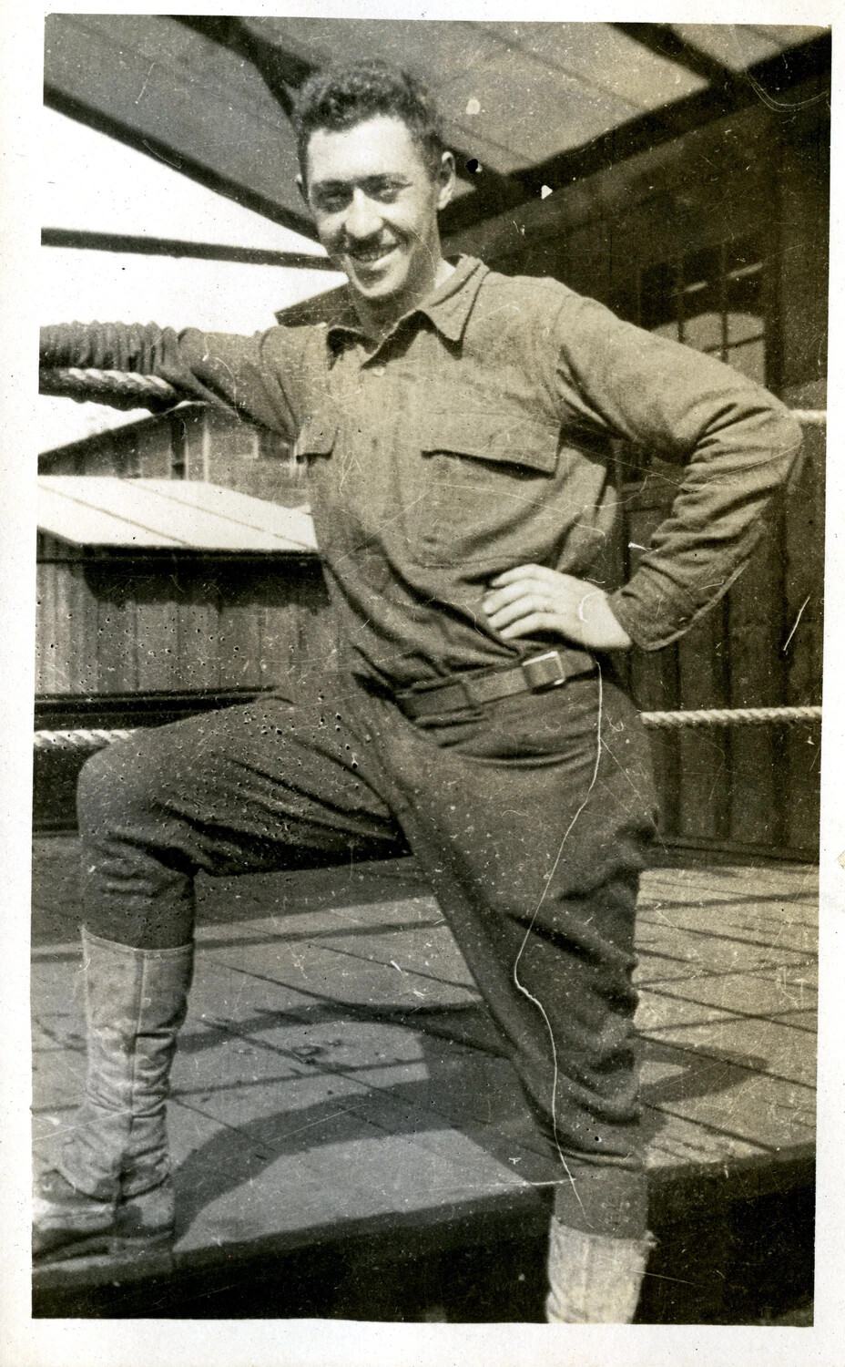 Candid Portrait of an American Soldier in Fatigue Uniform on a Barracks Porch, WWI Era