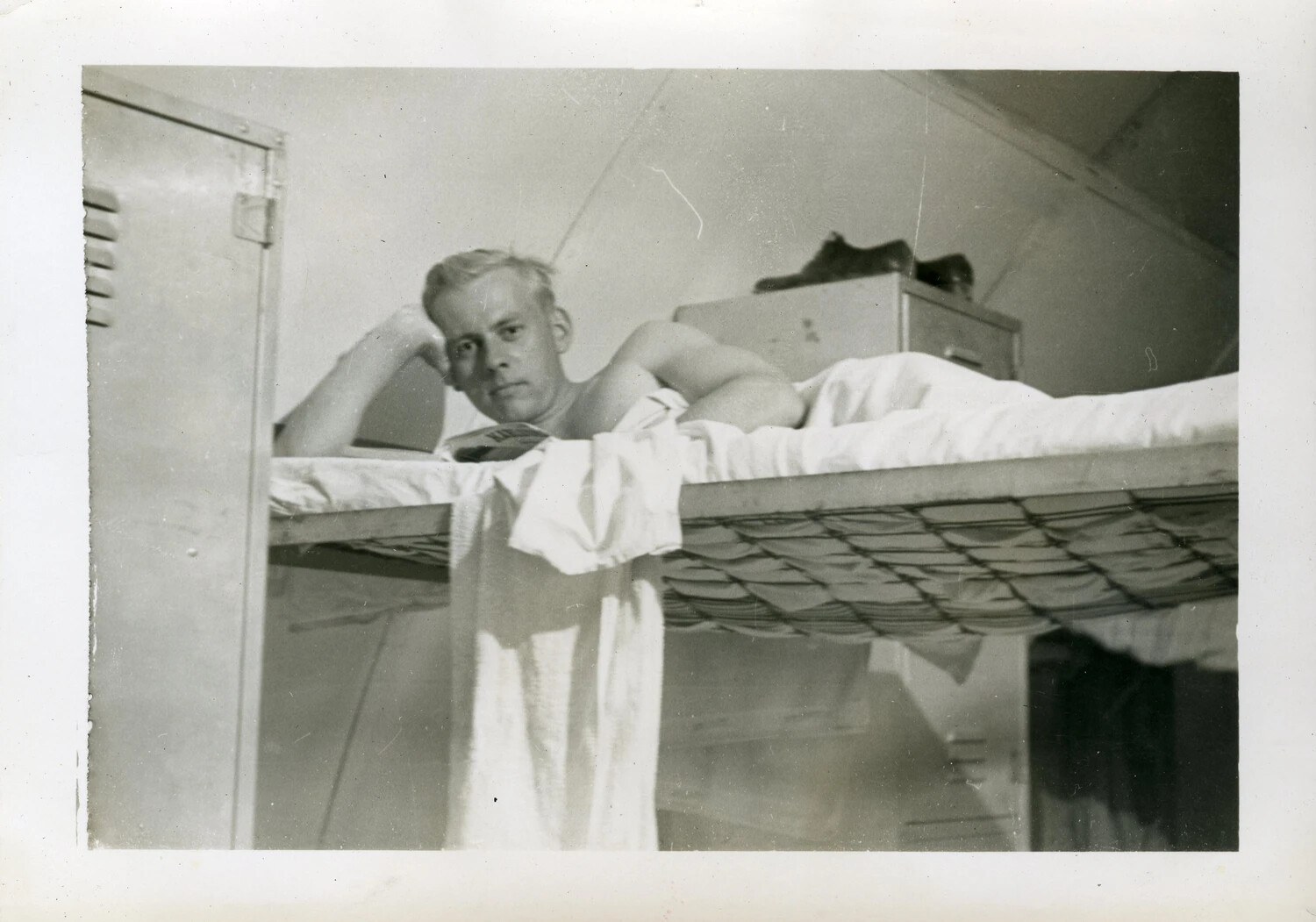 Sailor Reading on an Upper Bunk, VR-6 Quonset Hut Barracks, NAS Agana, Guam