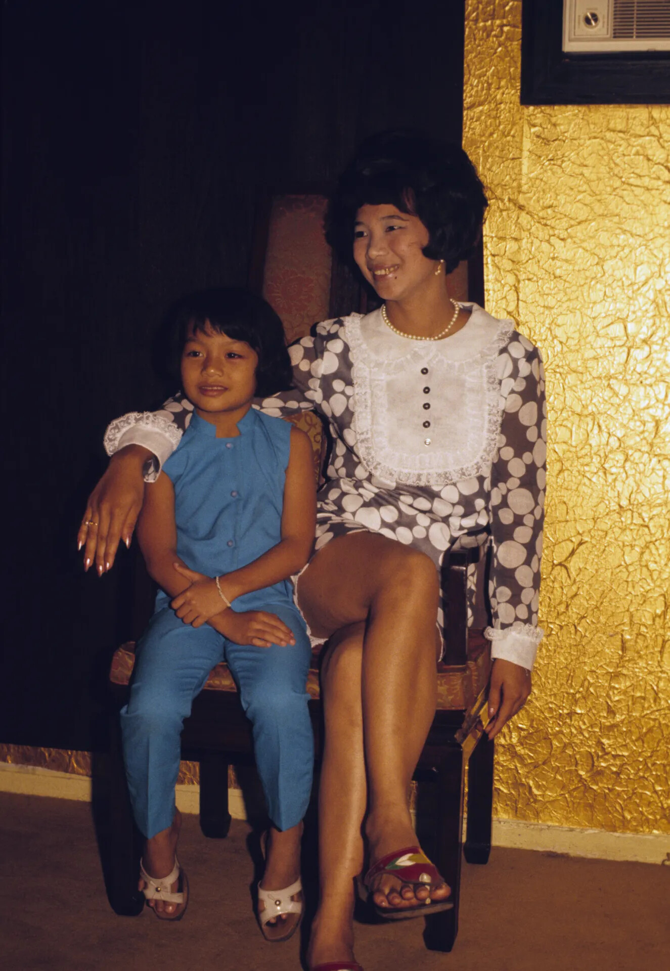 Woman and Young Girl Seated for Informal Portrait, Gold Textured Wall Backdrop