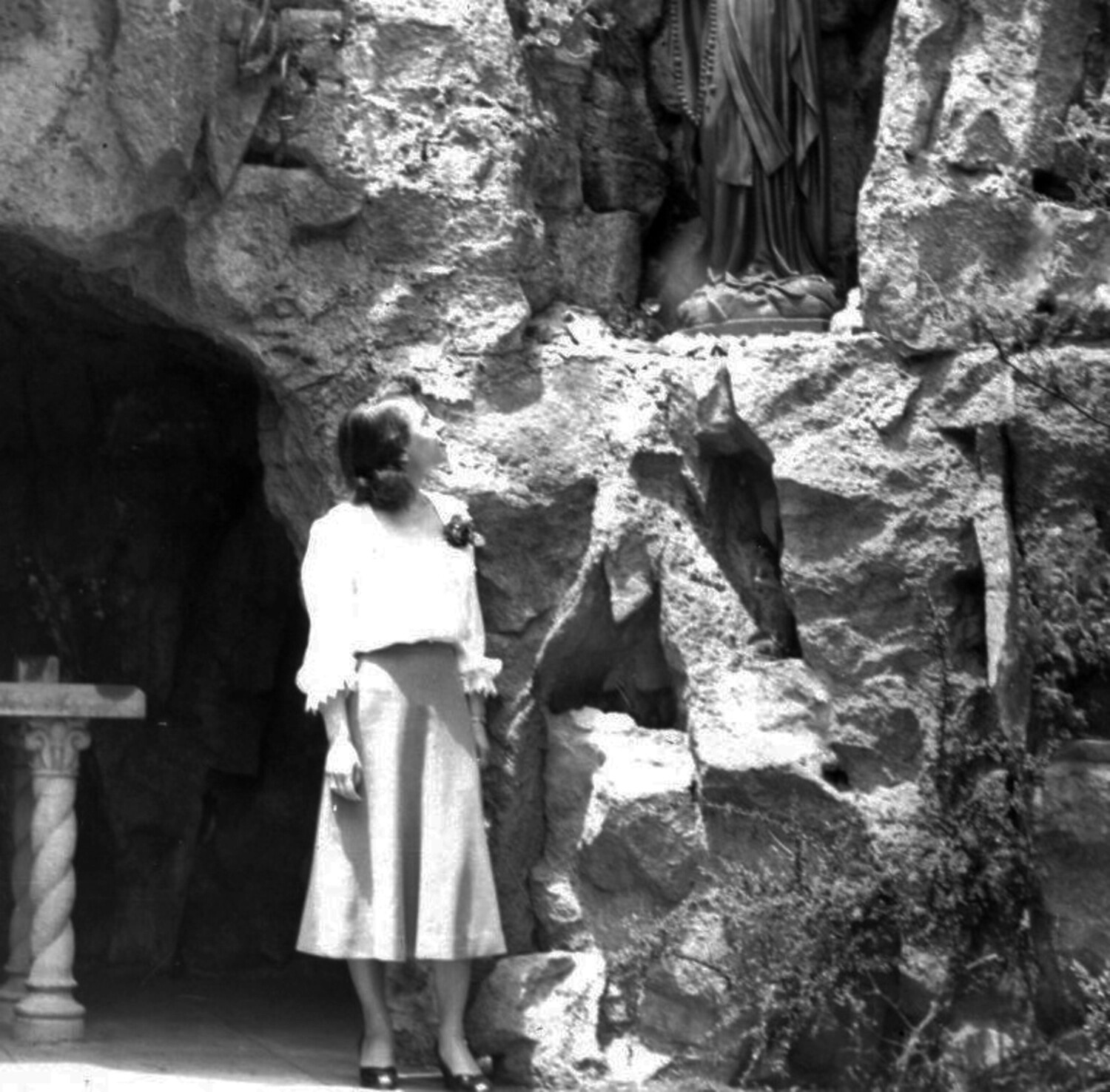 Woman at a Religious Grotto Shrine, Mid-20th Century Personal Photograph