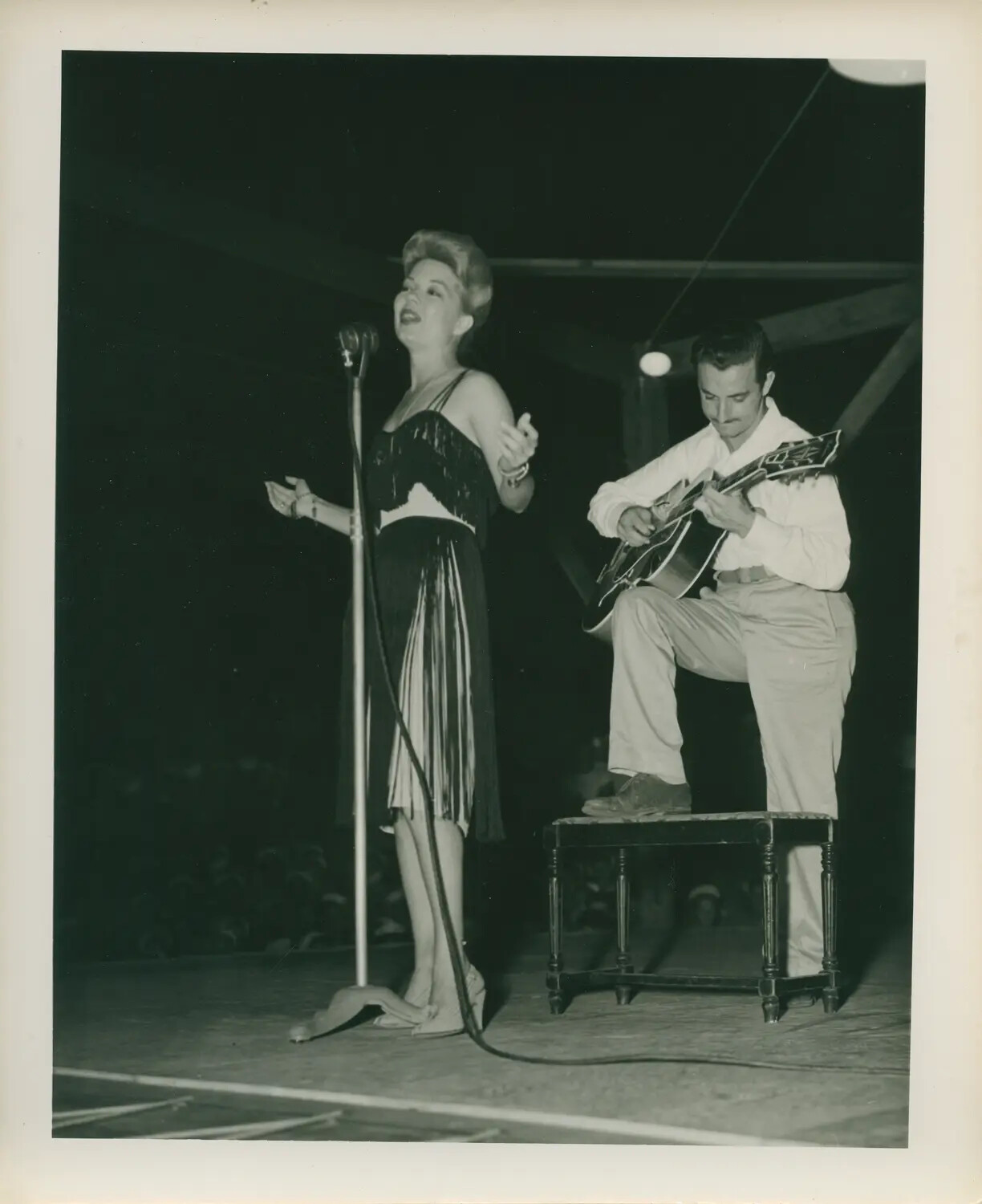Vocalist and Guitarist Performing on Outdoor Stage, Mid-20th Century Entertainment Photograph