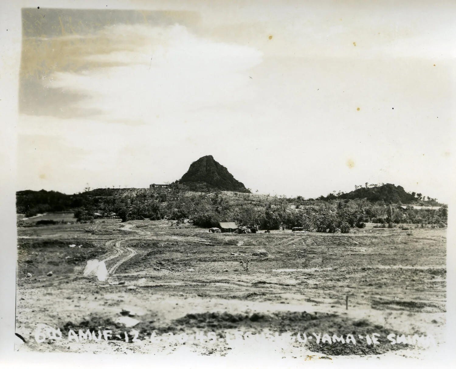 View of Iegusuku Peak ("The Pinnacle") and Unit Encampment, Ie Shima, Ryukyu Islands, 1945