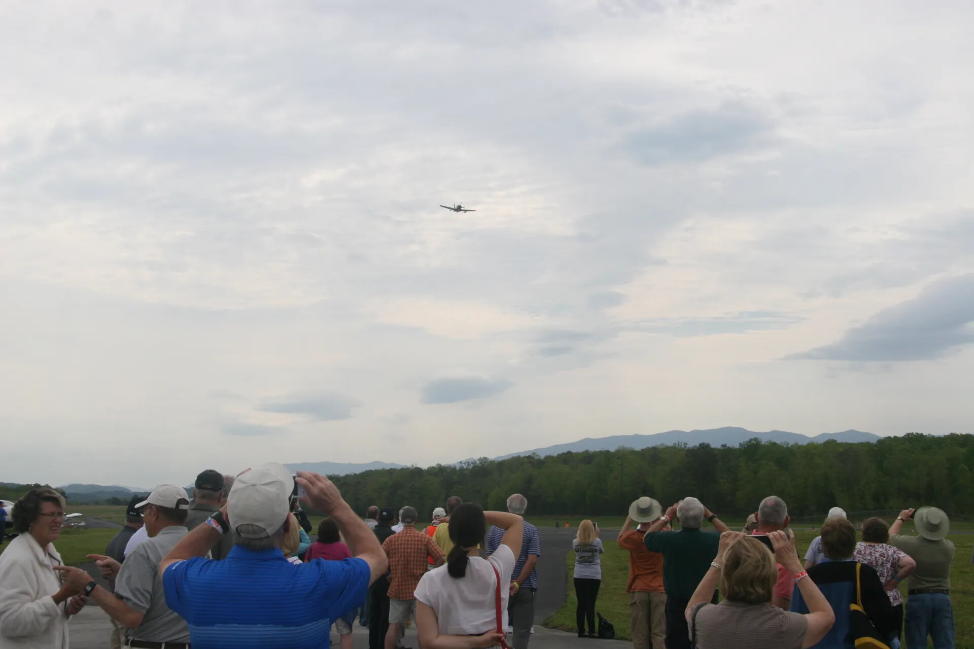Spectators Watch A-1 Skyraider Flyover at Operation Tailwind Commemorative Event, 2016
