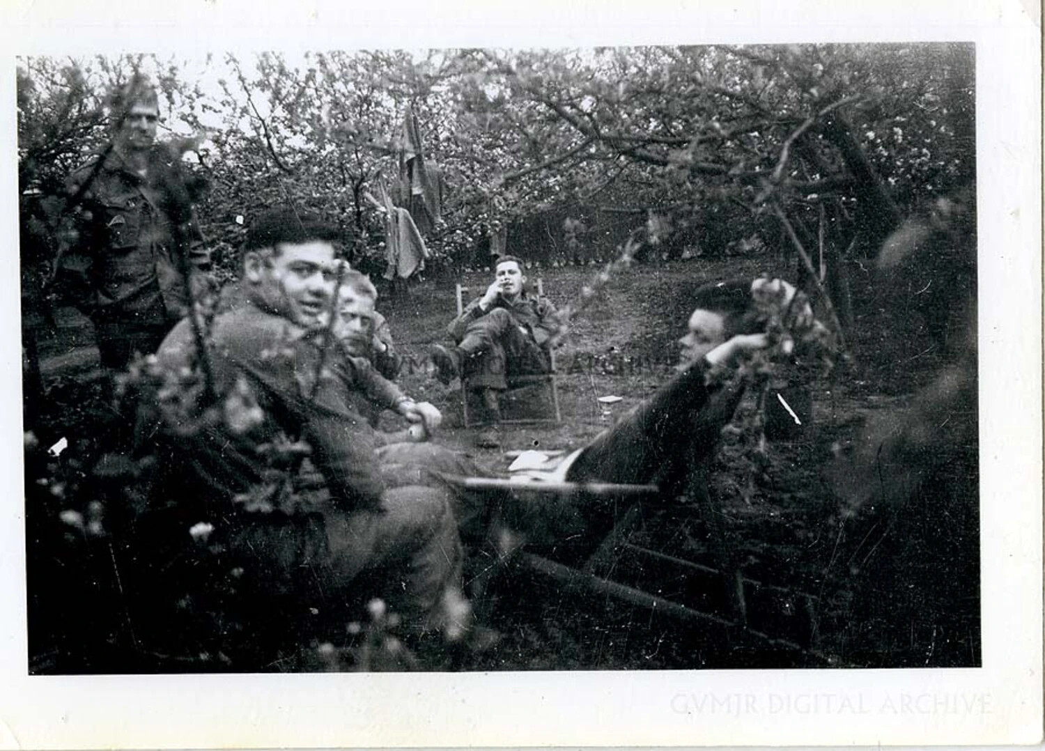 101st Airborne Paratroopers Resting in a Blossoming Orchard, Spring, WWII European Theater