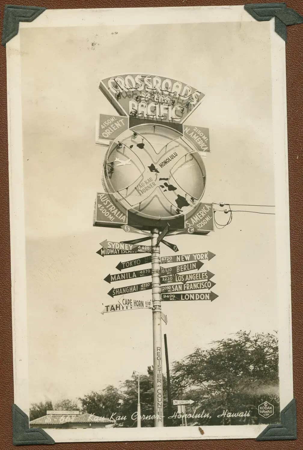 'Crossroads of the Pacific' Signpost, Kau Kau Corner, Honolulu, Hawaii — WWII-Era Souvenir Photograph