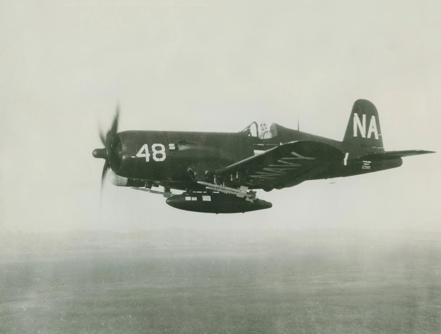 U.S. Navy Douglas AD Skyraider "48" (Tail Code NA) in Flight, Carrying Underwing Ordnance