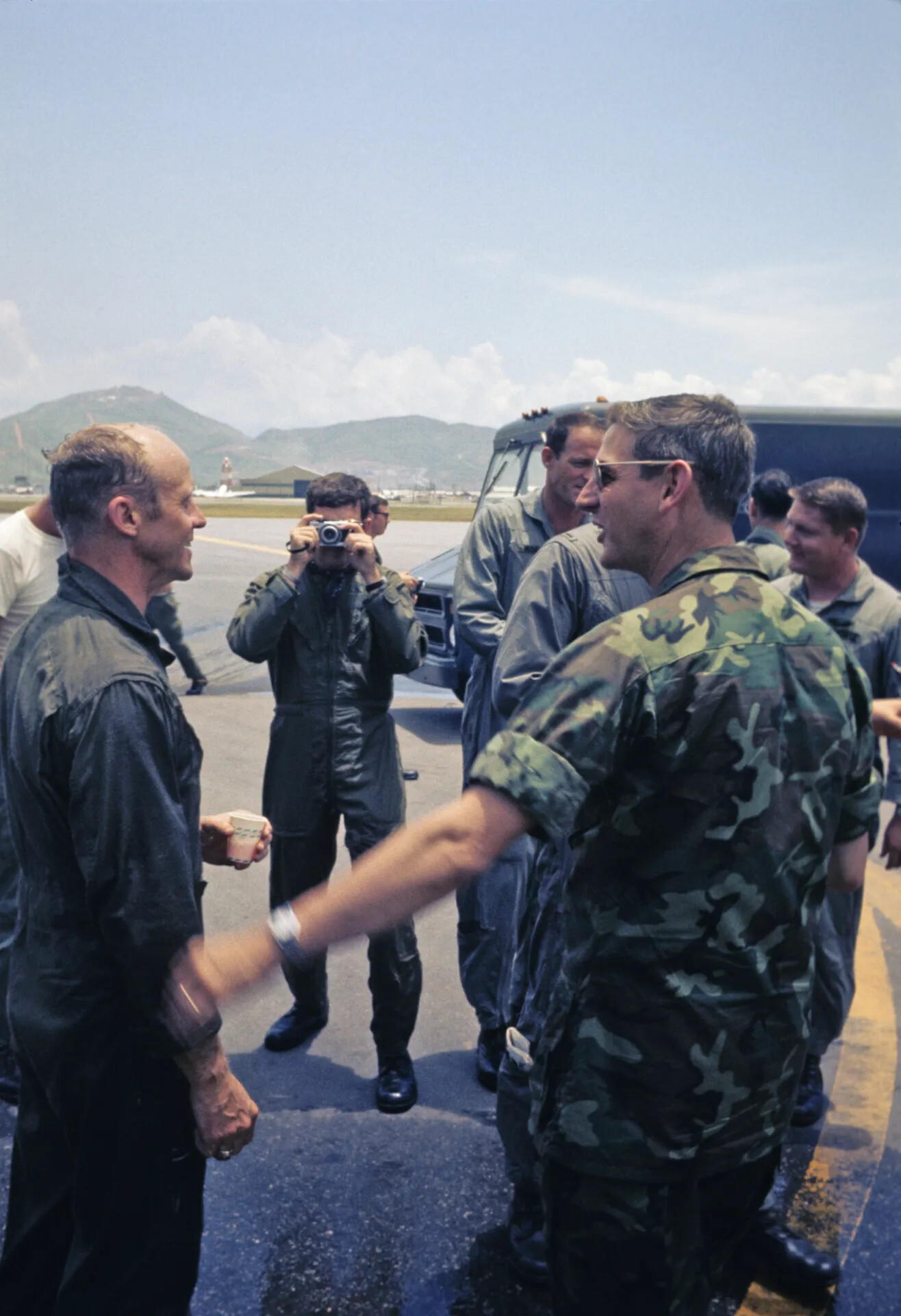 USAF Personnel Gathering and Handshake During Squadron Celebration, Vietnam War Era