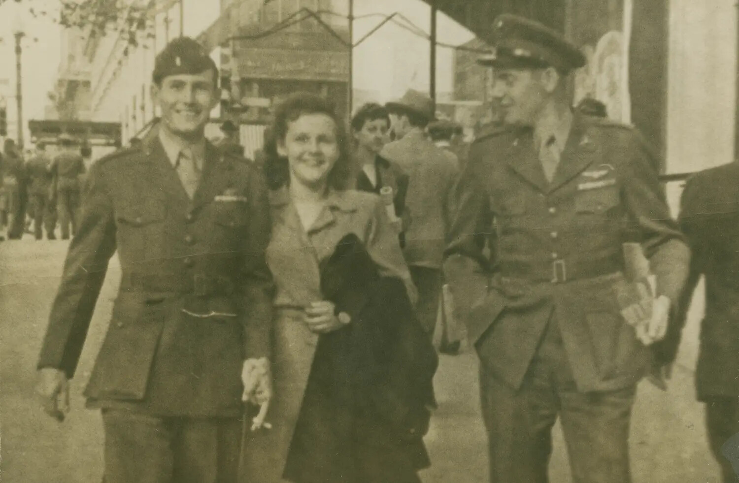 Airman and Fellow Officer with Companion on City Street, WWII Era