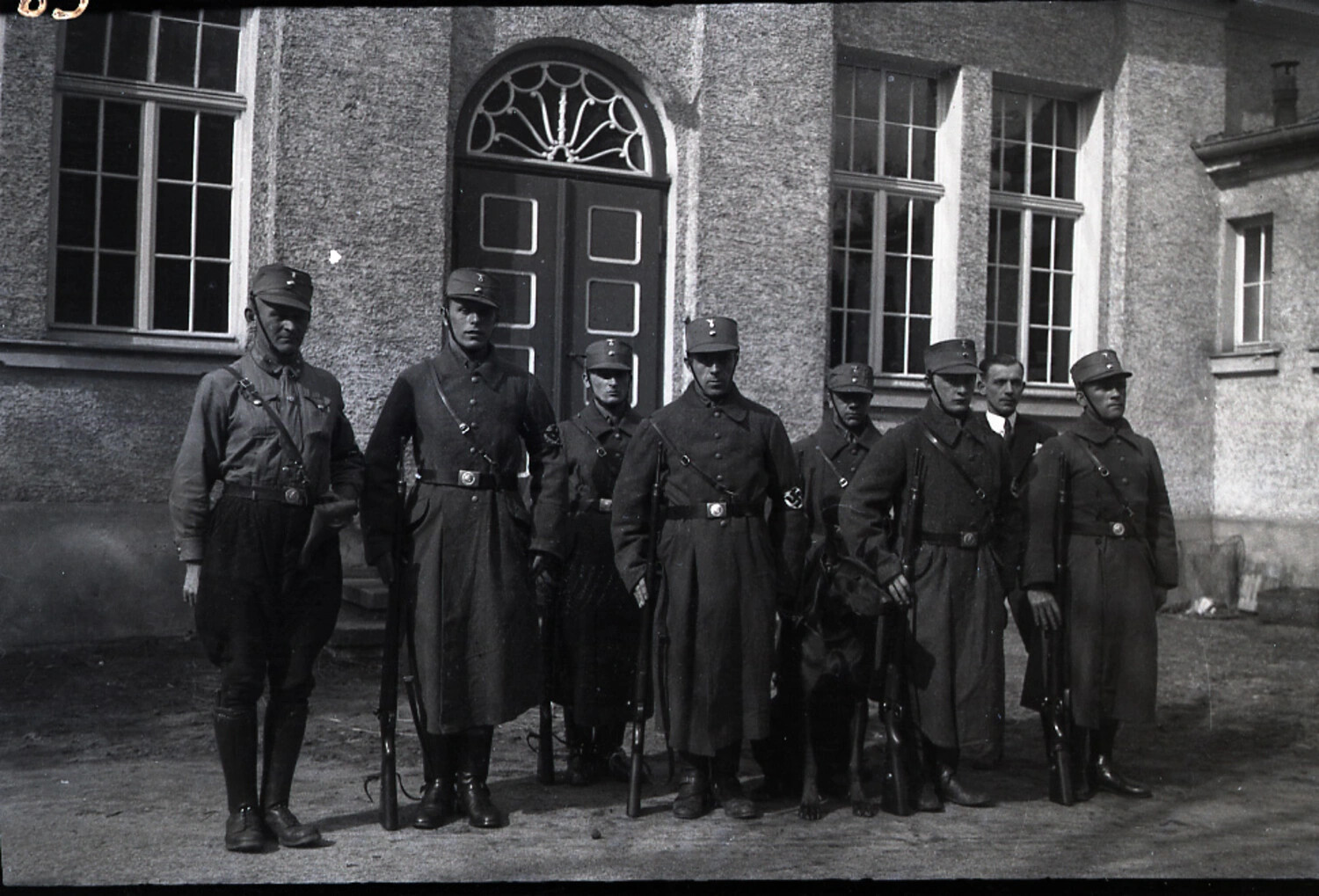 Group Portrait of Armed Early Nazi Party Paramilitary Members (SA/Freikorps-type) Outside a Stuccoed Building