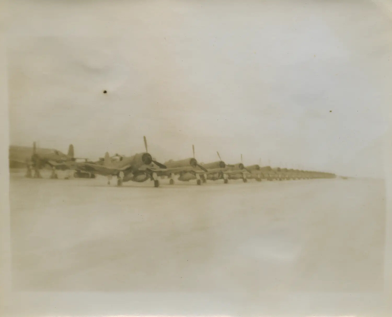 Row of Vought F4U Corsair Fighters on Flight Line, WWII Pacific Theater