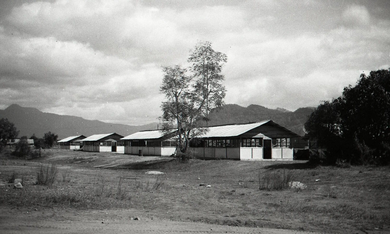 Row of Military Barracks Buildings in a Mountain Valley, Luzon, Philippines, World War II Era