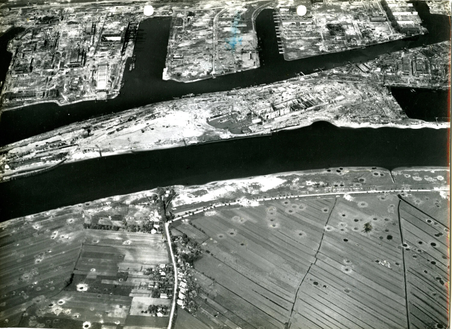 Aerial Reconnaissance Photograph of Bombed Industrial River Complex, European Theater, WWII