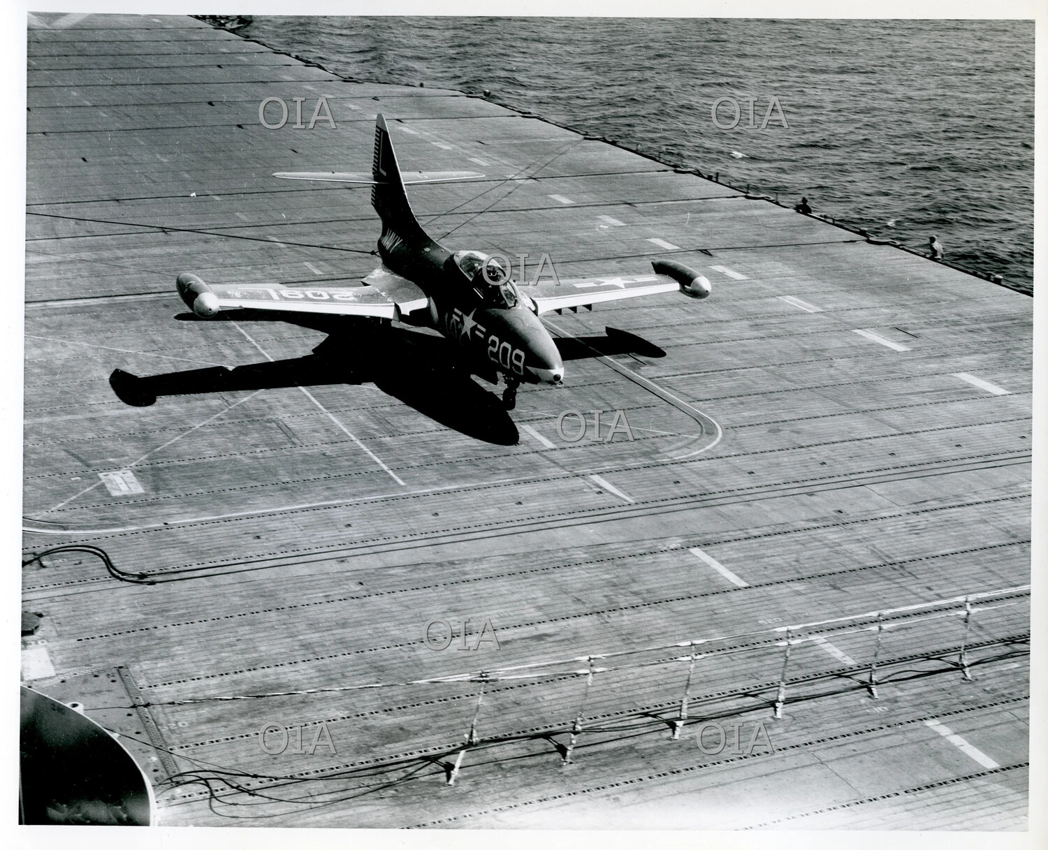 Swept-Wing Jet Aircraft (Modex 209) Landing Aboard USS Tarawa
