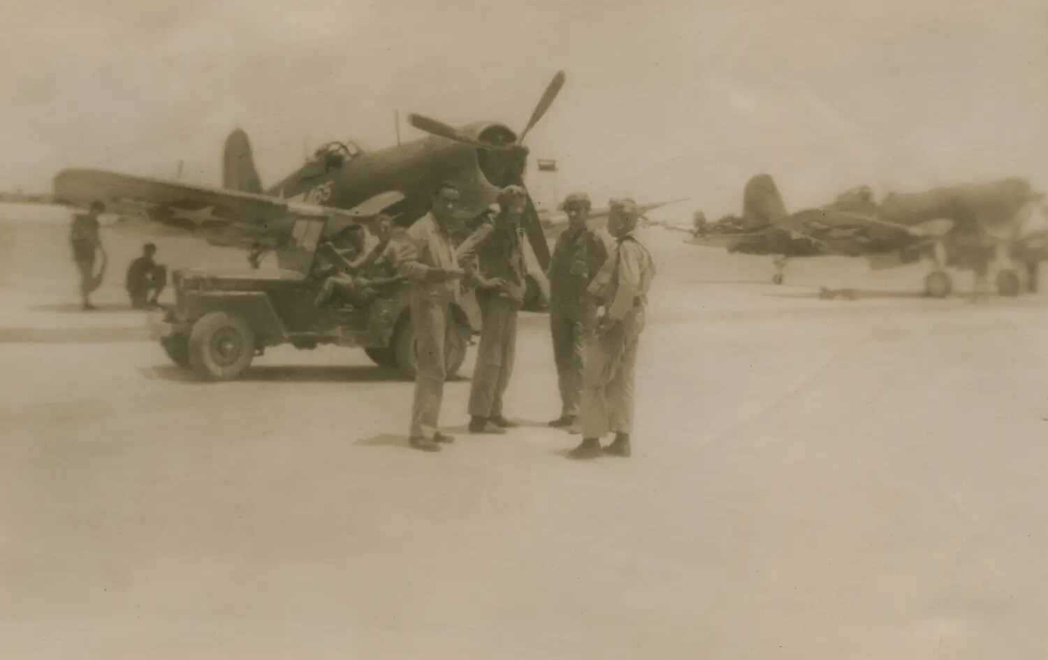 F4U Corsair Fighters and Aircrew on Flight Line, Pacific Theater, WWII (McAleer Collection)