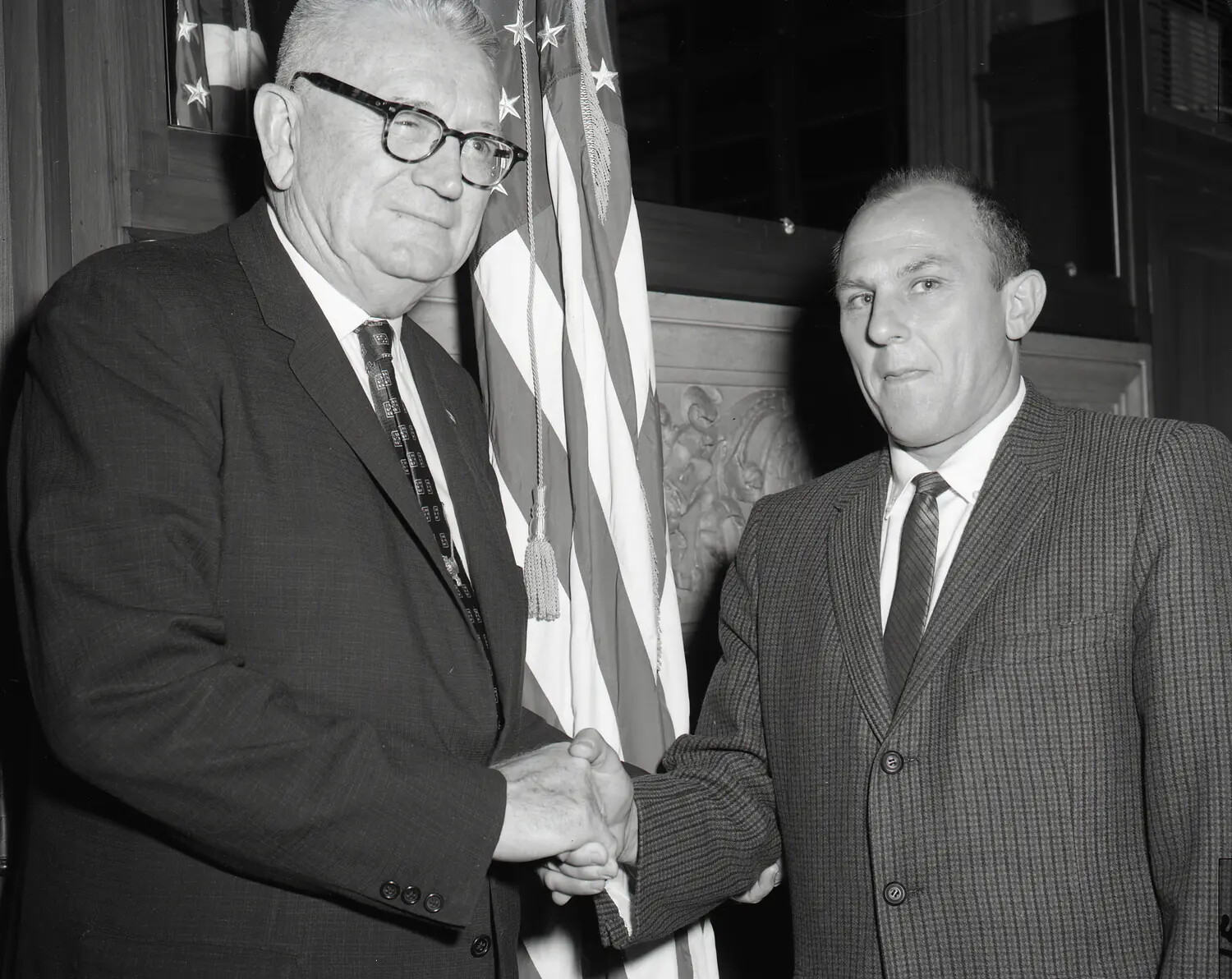 Ceremonial Handshake Portrait, Two Men Before American Flag